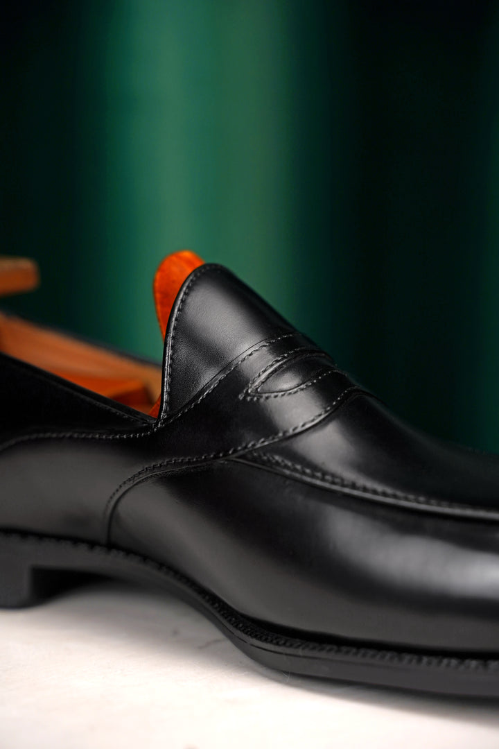 Black leather loafer shoes