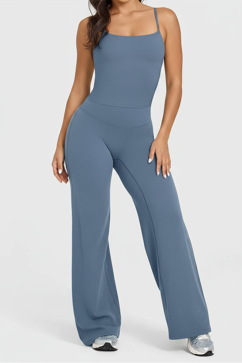 Person wearing a blue jumpsuit on a white background