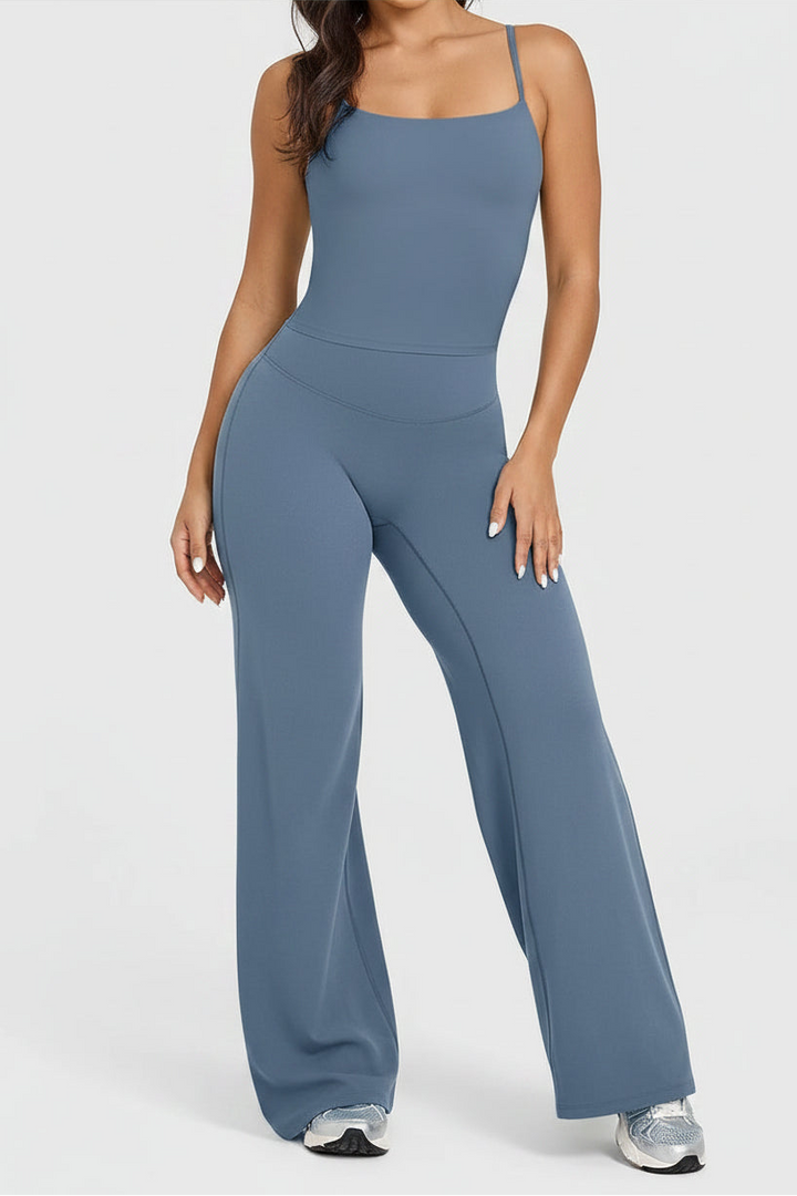 Person wearing a blue jumpsuit on a white background