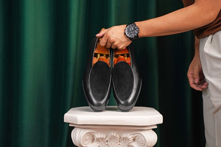 Pair of black suede loafers 